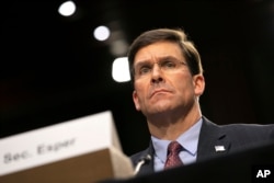 FILE - Defense Secretary Mark Esper testifies before the Senate Armed Services Committee about the budget, March 4, 2020, on Capitol Hill in Washington.