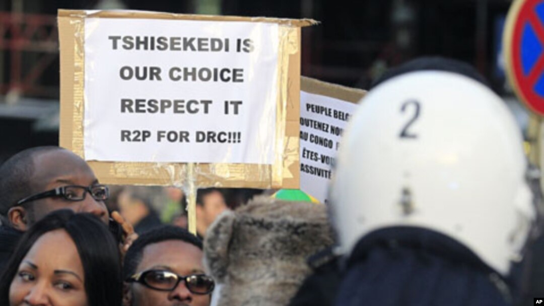 Supporters of Congolese opposition leader Etienne Tshisekedi, who has rejected results declaring President Joseph Kabila the winner, demonstrate in Brussels, December 10, 2011.