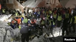 Search crew work in an area hit by an avalanche in Longyearbyen, the main settlement of the remote Arctic archipelago of Svalbard, Norway, Dec. 19, 2015.