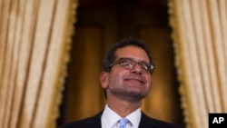 Pedro Pierluisi, sworn in as Puerto Rico's governor, smiles during a press conference in San Juan, Puerto Rico, Aug. 2, 2019.