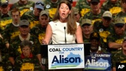 FILE - Kentucky Democratic Senatorial candidate Alison Lundergan Grimes speaks to a group of supporters, including members of the United Mine Workers Association.
