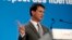 FILE - French Prime Minister Manuel Valls, pictured at a Paris news conference in March, has urged left-wingers to back mainstream right-wingers in regions where National Front candidates can win Sunday.