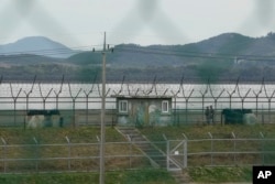 South Korean army soldiers patrol along the barbed-wire fence in Paju, South Korea, near the border with North Korea, Oct. 14, 2024.