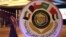 The seal of the Gulf Cooperation Council and an announcement of its meeting this week is on display in Kuwait City, Dec. 4, 2017.