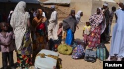 FILE - Families from Gwoza, Borno State, displaced by the violence and unrest caused by the insurgency, are seen at a refugee camp in Mararaba Madagali, Adamawa State, Feb. 18, 2014.