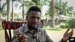 FILE: Ugandan opposition figure Bobi Wine, whose real name is Kyagulanyi Ssentamu, at his home in Magere, north of the capital Kampala, in Uganda, Tuesday, Oct. 4, 2022. A pipeline to export oil from Uganda is likely to bolster the rule of President Yoweri Museveni, Wine said.
