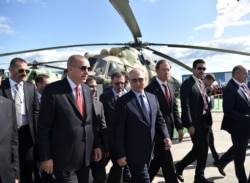 Russian President Vladimir Putin and his Turkish counterpart Recep Tayyip Erdogan visit the MAKS 2019 air show in Zhukovsky, outside Moscow, Russia, Aug. 27, 2019.