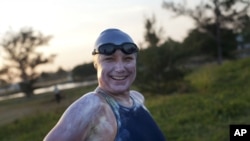 British-Australian swimmer Penny Palfrey, smiles before beginning her bid to complete a record swim from Cuba to Florida, in Havana, Cuba, June 29, 2012. 