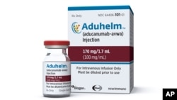 This image provided by Biogen, June 7, 2021 shows a vial and packaging for the drug Aduhelm.