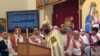 Father Bishoy Andrawes leads a Christmas celebration at the St. Mark Orthodox Church in Fairfax, Virginia on January 6, 2013. (Mohamed Elshinnawi)