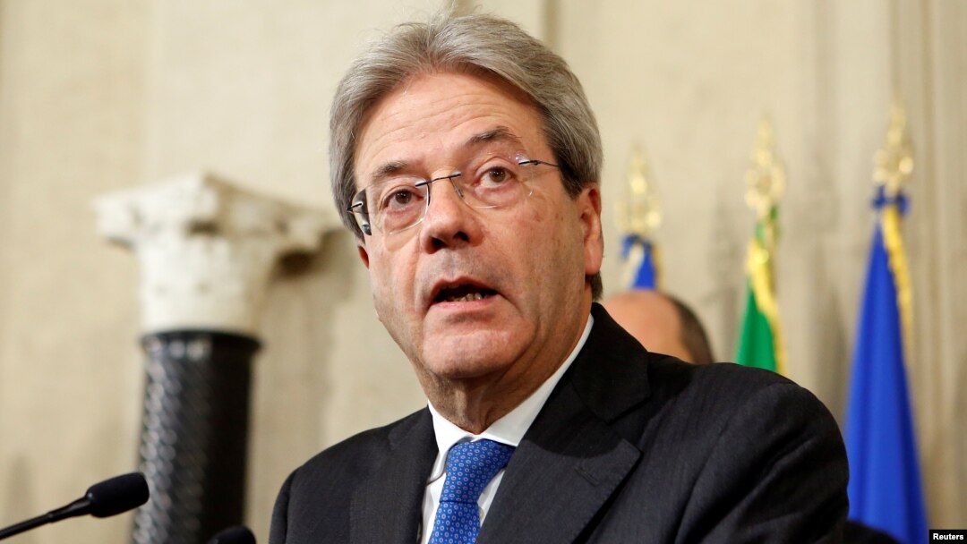 Italy's Foreign Minister Paolo Gentiloni talks to reporters after receiving a mandate to try to form the country's new government, at the Quirinal Palace in Rome, Dec. 11, 2016. 