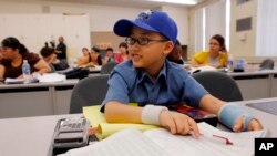 Moshe Kai Cavalin, 10, takes statistics college classes at the East Los Angeles College in Los Angeles, California.