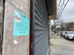 The storefront of this former Black-owned businesses remains shuttered in this Washington, D.C., neighborhood that was once the site of a thriving Black business community. (Chris Simkins/VOA)