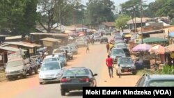 Cars and people move through Ekok, a Cameroonian village on the southwestern border with Nigeria.