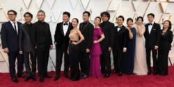The cast and crew of "Parasite" arrive at the Oscars, at the Dolby Theatre in Los Angeles, California, Feb. 9, 2020.