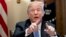President Donald Trump points to members of the media as he speaks during a meeting with inner city pastors in the Cabinet Room of the White House in Washington, Aug. 1, 2018.