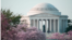 The Jefferson Memorial can be seen through cherry blossoms in full bloom along the Tidal Basin in Washington, DC, April 13, 2014. (Elizabeth Pfotzer/VOA)