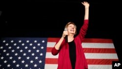 Sen. Elizabeth Warren, D-Mass, waves to the crowd during an organizing event at Curate event space in Des Moines, Iowa, Jan. 5, 2019.