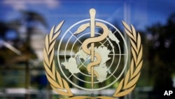 FILE - The World Health Organization logo is seen at its Geneva headquarters. 