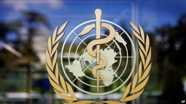 FILE - The World Health Organization logo is seen at its Geneva headquarters. The WHO has reported a one-day record high in coronavirus cases worldwide, with more than 350,000 cases reported to the U.N. health agency on Oct. 9, 2020.