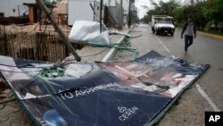 A billboard lays on the ground, toppled by Hurricane Zeta in Playa del Carmen, Mexico, Oct. 27, 2020.