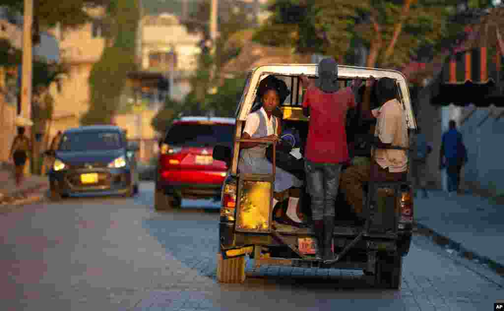 Students ride to school in a &quot;tap-tap,&quot; a vehicled used for public transportation, in Port-au-Prince, Haiti.