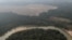 FILE - Aerial view shows a river and a deforested plot of the Amazon near Porto Velho, Rondonia State, Brazil, Aug. 14, 2020. 