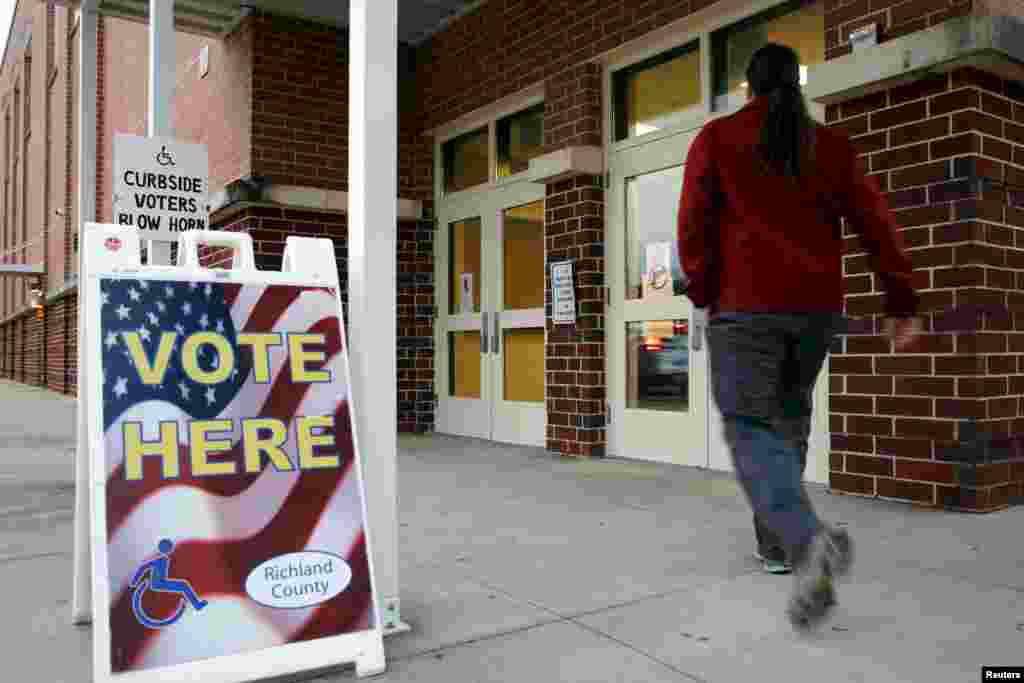 A voter arrives to cast his ballot in the U.S. Republican presidential primary at a polling place at Dreher High School in Columbia, S.C., Feb. 20, 2016.