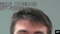  This undated photo provided by the Weber County Sheriff's Office shows Aaron Shamo, 27, who was arrested at his home in Cottonwood Heights, Utah. 