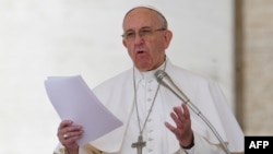 Pope Francis addresses the crowd during the Regina Coeli prayer at St Peter's square at the Vatican, April 30, 2017.