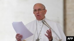 FILE - Pope Francis addresses the crowd during the Regina Coeli prayer at St Peter's square at the Vatican, April 30, 2017.