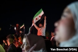 Syrians took to Umayyad Square in downtown Damascus to celebrate the fall of Bashar al-Assad’s regime, Dec. 13, 2024.