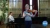 High-Tech Baton Lets Blind Musicians Follow Conductor's Lead by Feel
