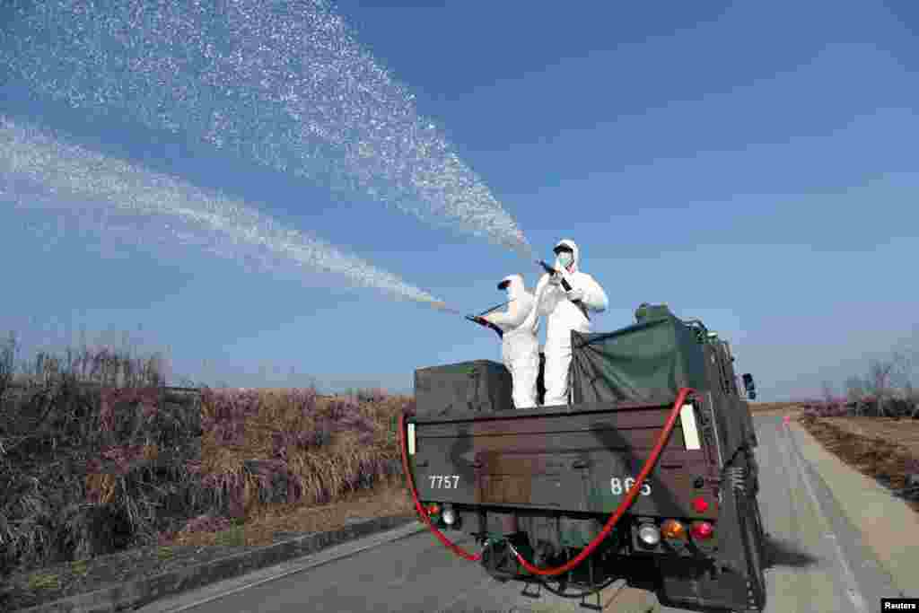 South Korean navy soldiers disinfect in Changwon.