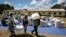 Zimbabwean villagers collect their monthly rations of food aid about 254km north of Harare March 7, 2013. 