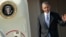 FILE - President Barack Obama waves as he steps off Air Force One.