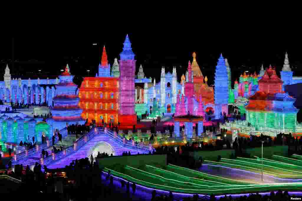 Ice sculptures lit by colored lights are seen at the yearly ice festival, in the northern city of Harbin, Heilongjiang province, China.