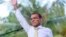 Former president of the Maldives Mohamed Nasheed waves as he addresses the country after returning from exile to the Maldives, in Male, Nov.18.