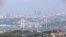 FILE - A general view of the July 15 Martyrs Bridge, or Bosphorus Bridge, as seen from a hill, in Istanbul, June 23, 2019. 