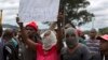 South Africans wave anti-immigration placards during a protest in Pretoria, South Africa, Feb. 24, 2017. Resentment against foreigners has sometimes turned deadly in South Africa amid accusations that they take jobs from locals.