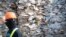 FILE - A container is filled with plastic waste from Australia, in Port Klang, Malaysia, May 28, 2019.