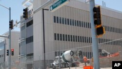 One of the buildings on the campus of the Veterans Administration hospital still under construction, June 8, 2017, in Aurora, Colo. The United States Justice Department has declined to prosecute Veterans Affairs Department executives after lawmakers accused two of them of misleading Congress about massive cost overruns.