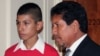 Saul Arellano, left, the son of a Mexican woman deported from the U.S., stands with an immigration activist at a meeting of the Congressional Hispanic Congress in Washington, DC on June 5, 2013. 