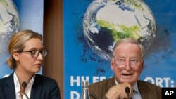 Alice Weidel, left, and Alexander Gauland, right, top candidates of the German AfD (Alternative for Germany) party for the upcoming general elections, attend a press conference in Berlin, Germany, Monday, Aug. 21, 2017. 