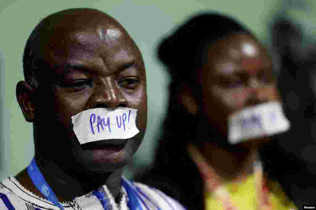 Activists take part in a protest calling on developed nations to provide financing to fight climate change, during the COP29 United Nations Climate Change Conference, in Baku, Azerbaijan.