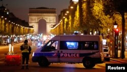 Police secure the Champs-Elysees avenue after one policeman was killed and another wounded in a shooting incident in Paris, France, April 20, 2017. 