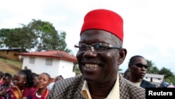 FILE - Prince Johnson, who at the time was himself a presidential candidate, campaigns in the village of Demeh in Bomi County, Liberia, Sept. 14, 2011. The former warlord has endorsed George Manneh Weah in next month's presidential runoff.