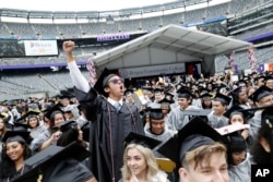 FILE - Some students do move on and do well after community college. Here is the Bergen Community College commencement at MetLife Stadium in East Rutherford, N.J., Thursday, May 17, 2018. (AP Photo/Seth Wenig)