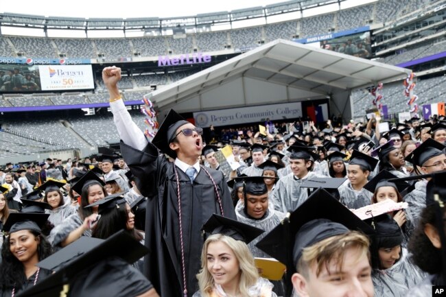 FILE - Some students do move on and do well after community college. Here is the Bergen Community College commencement at MetLife Stadium in East Rutherford, N.J., Thursday, May 17, 2018. (AP Photo/Seth Wenig)