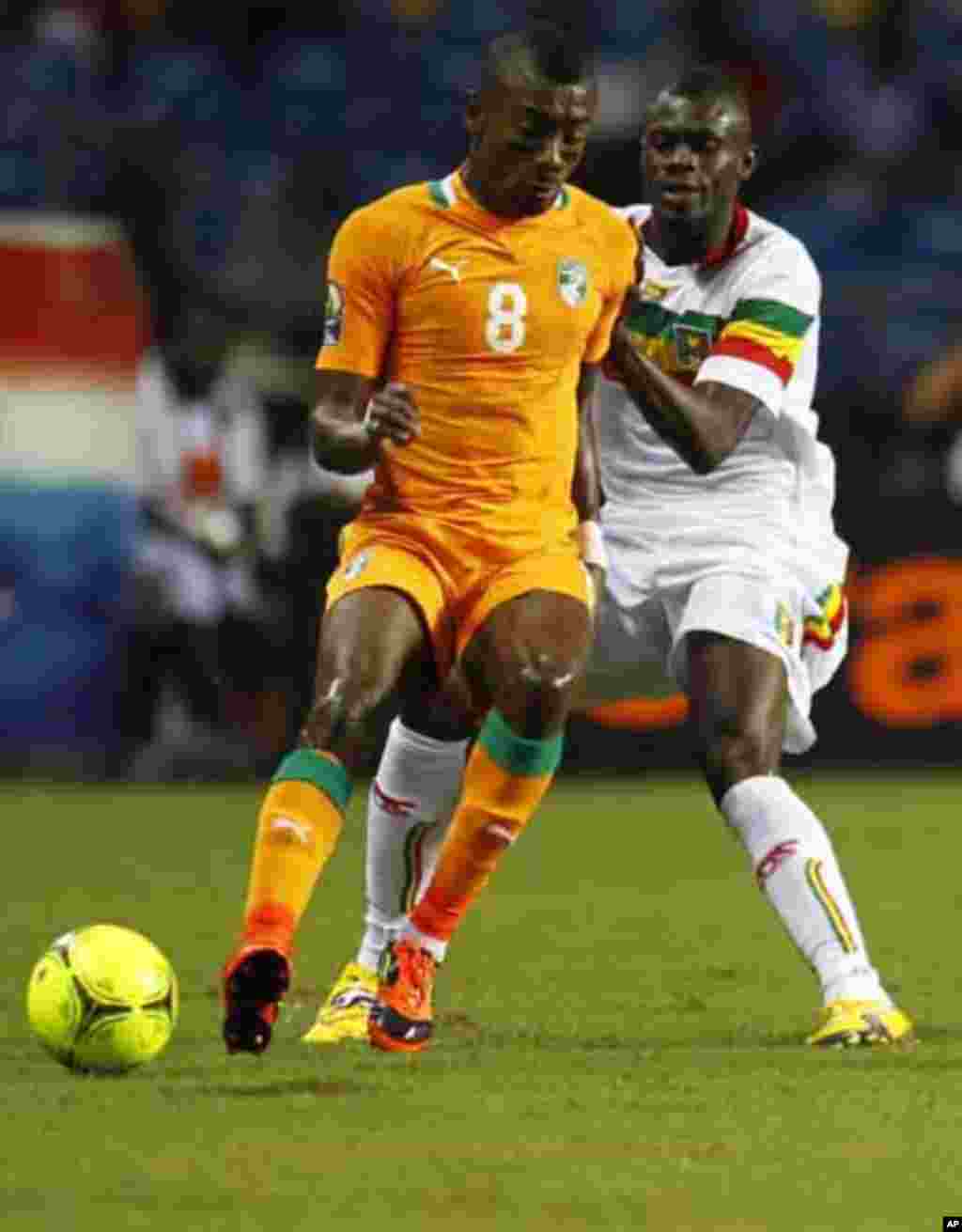 Ivory Coast's Salomon Kalou (8) plays against Mali's Mustapha Yatabare during their African Nations Cup semi-final soccer match at the Stade De L'Amitie Stadium in Gabon's capital Libreville February 8, 2012.